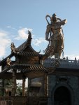 Bronzt Statue in front of Kuan Yn Statue
