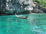 Boatman sleeping in his long tail boat