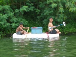 Paddling with their improvised paddle